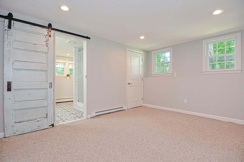 2 Labo Lane Bedford, MA 01730 - Photo 33 of 40 an empty room with windows and closet