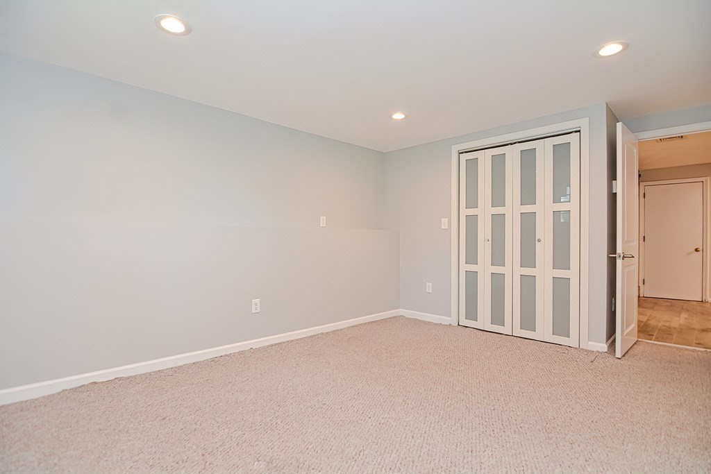2 Labo Lane Bedford, MA 01730 - Photo 36 of 40 an empty room with a empty space and entrance