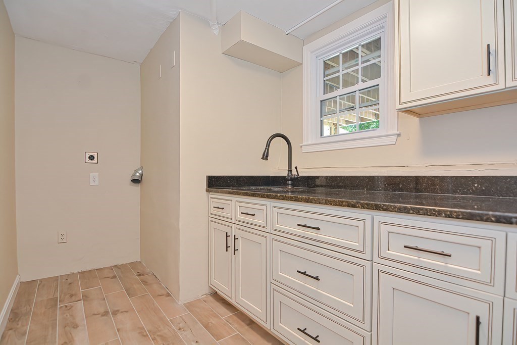 2 Labo Lane Bedford, MA 01730 - Photo 37 of 40 a close view of a kitchen sink and cabinets
