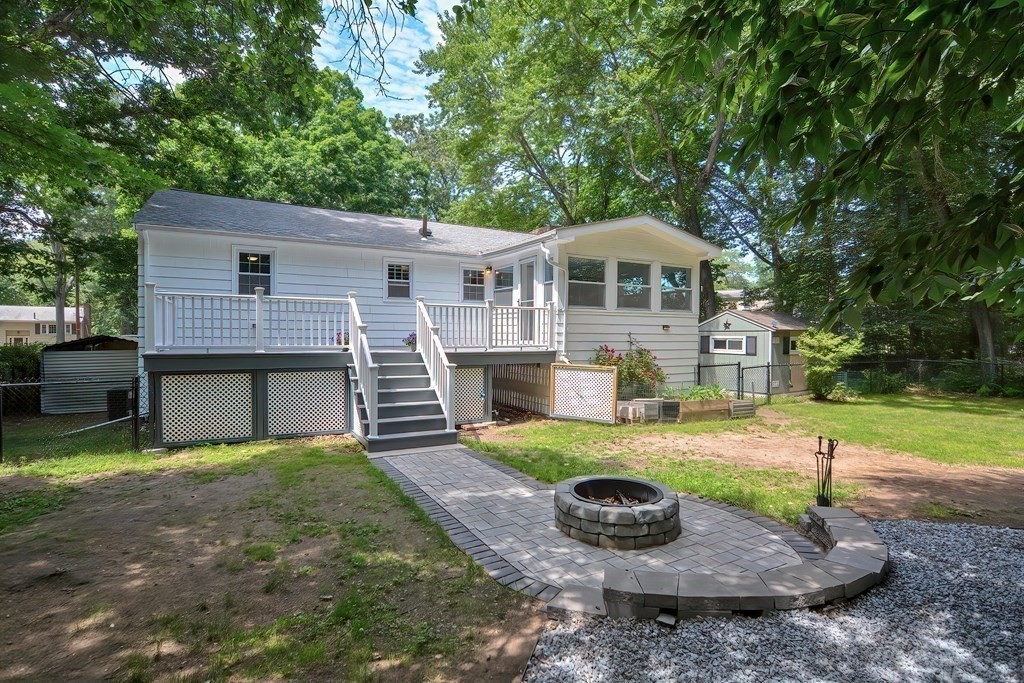 2 Labo Lane Bedford, MA 01730 - Photo 38 of 40 a front view of a house with a yard