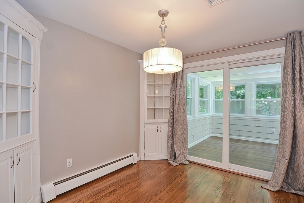 2 Labo Lane Bedford, MA 01730 - Photo 9 of 40 a view of livingroom with hardwood floor and window