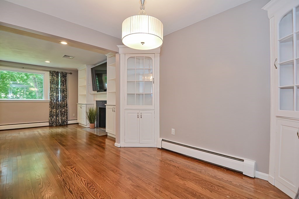 2 Labo Lane Bedford, MA 01730 - Photo 10 of 40 an empty room with wooden floor and windows