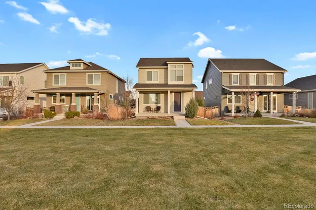 a front view of a house with swimming pool having outdoor seating