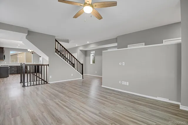 a view of an entryway with wooden floor