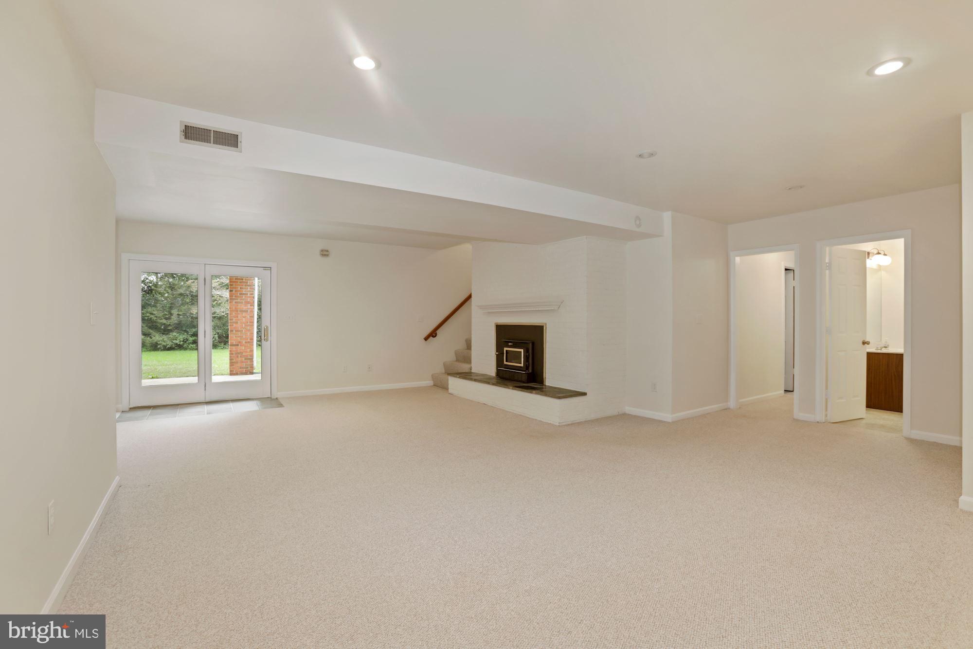 11502 Fox Hill Road Culpeper, VA 22701 - Photo 23 of 49 Walkout basement has rec room w/ wood stove insert