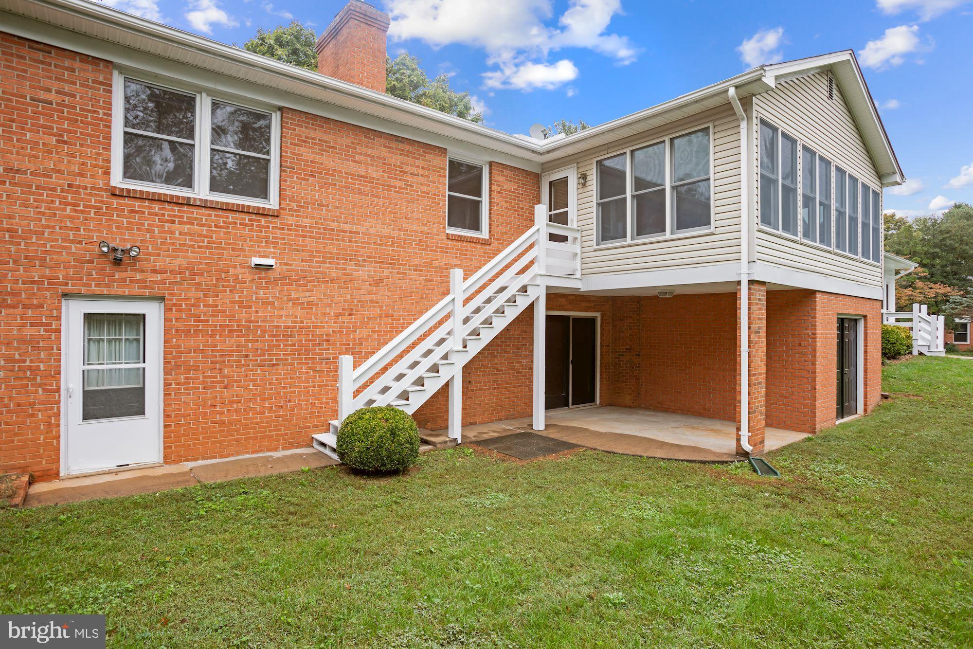 11502 Fox Hill Road Culpeper, VA 22701 - Photo 36 of 49 Sunroom extension with enclosed storage beneath.