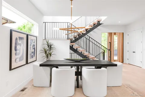 a view of entryway with furniture and stairs