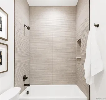 a bathroom with a bathtub and shower
