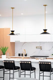 a kitchen with a table and chairs in it