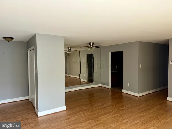 a view of a livingroom with wooden floor