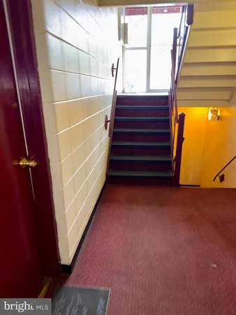 an empty room with wooden floor