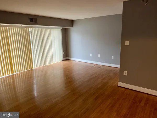 a kitchen with a sink and a refrigerator