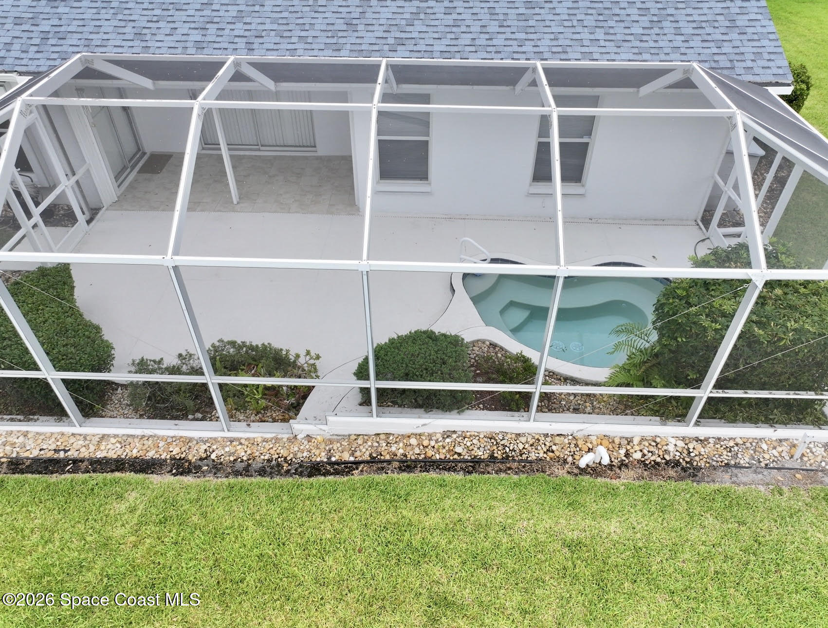 1230 Meadowbrook Road Northeast Palm Bay, FL 32905 - Photo 22 of 43 Screened In Back Patio