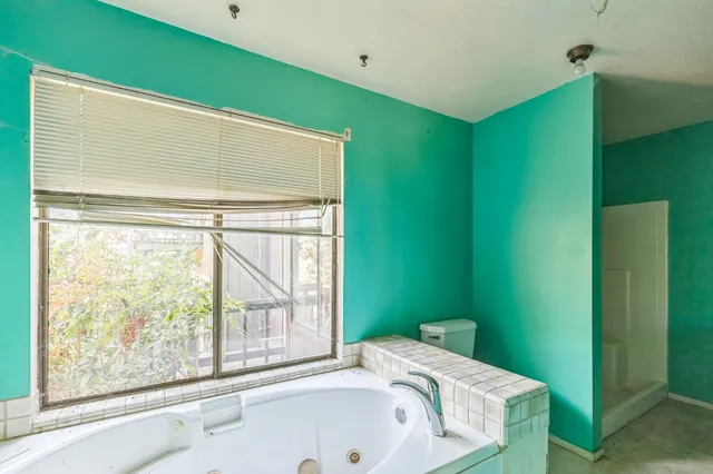 a bathroom with a sink and a large window