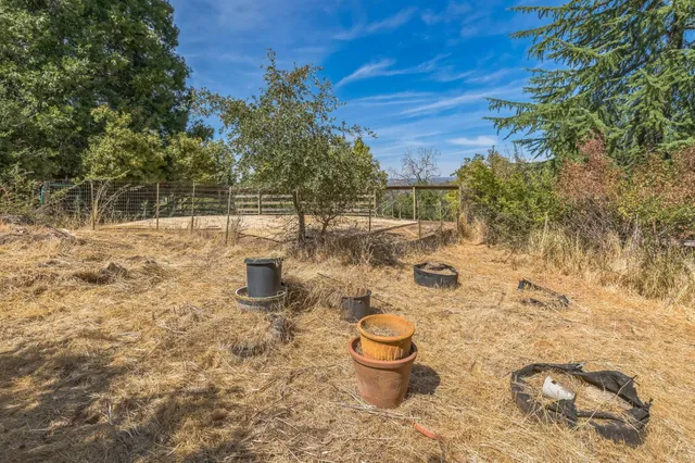a view of a backyard of the house