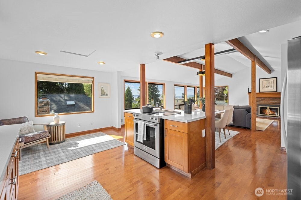 902 7th Avenue South Edmonds, WA 98020 - Photo 10 of 31 a large kitchen with stainless steel appliances granite countertop a stove and a view of living room