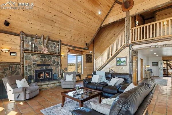 a living room with furniture and a table
