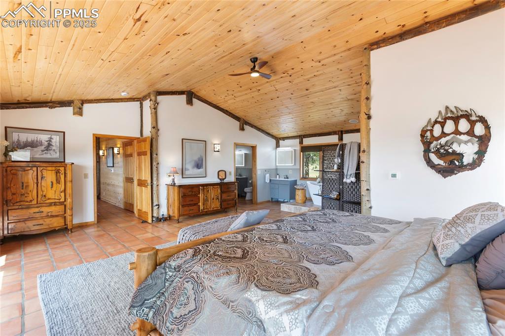 790 Tiara Road Lake George, CO 80827 - Photo 17 of 47 a bed room with a bed and a television