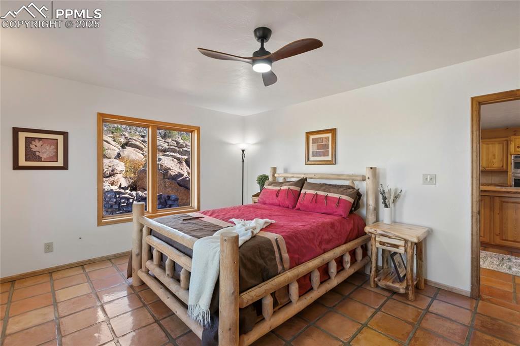 790 Tiara Road Lake George, CO 80827 - Photo 27 of 47 a bedroom with a bed and a table in it