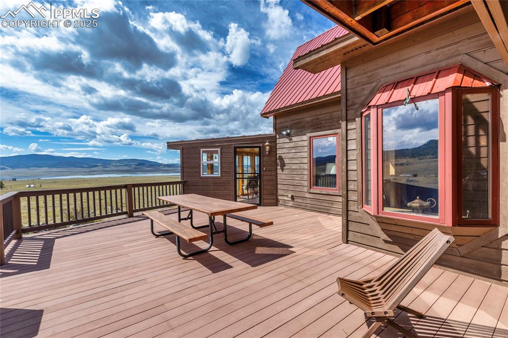 790 Tiara Road Lake George, CO 80827 - Photo 39 of 47 a view of a patio with table and chairs and wooden floor