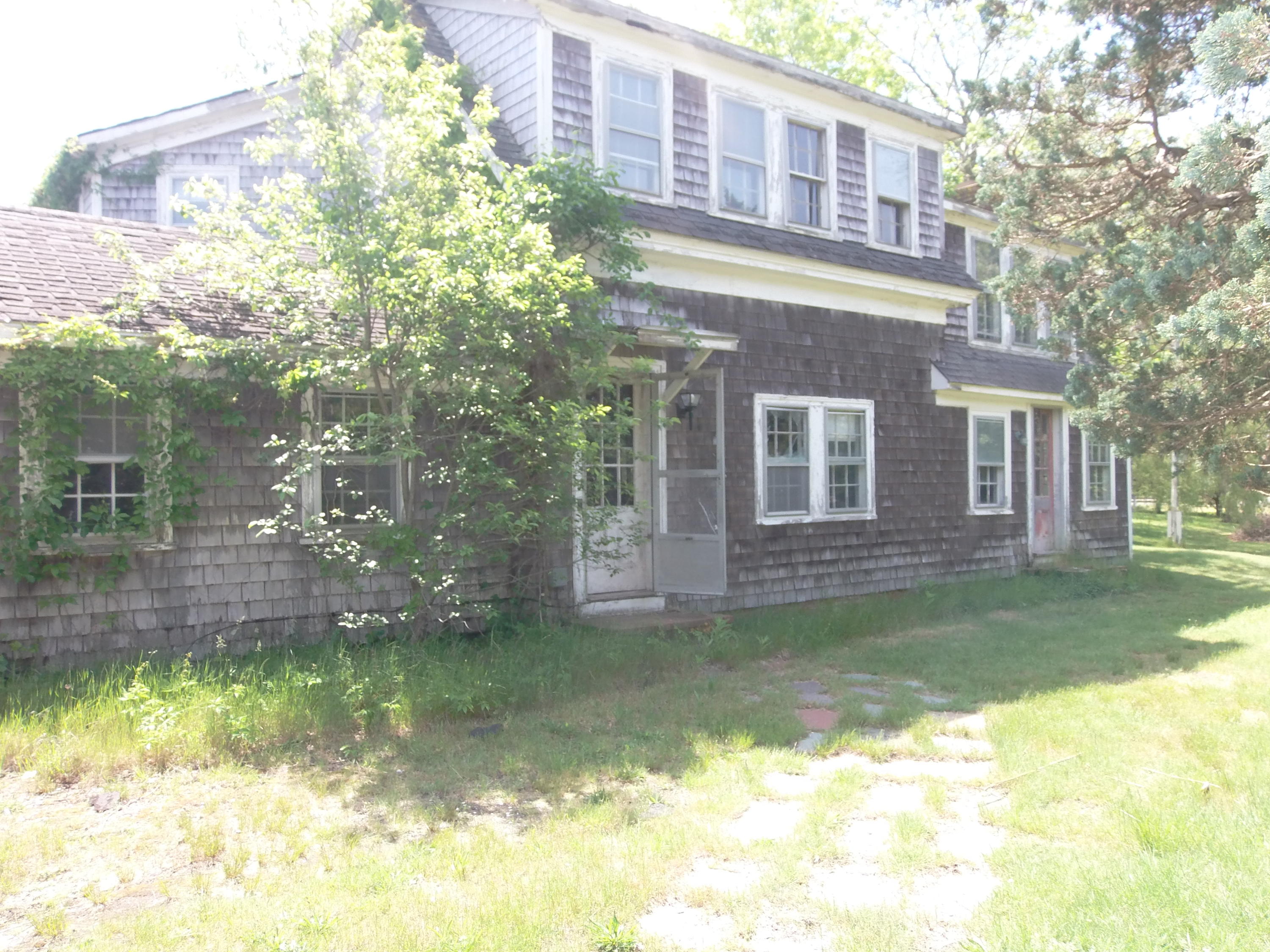 14 Pine Road West Dennis, MA 02670 - Photo 3 of 8 a view of a house with a yard