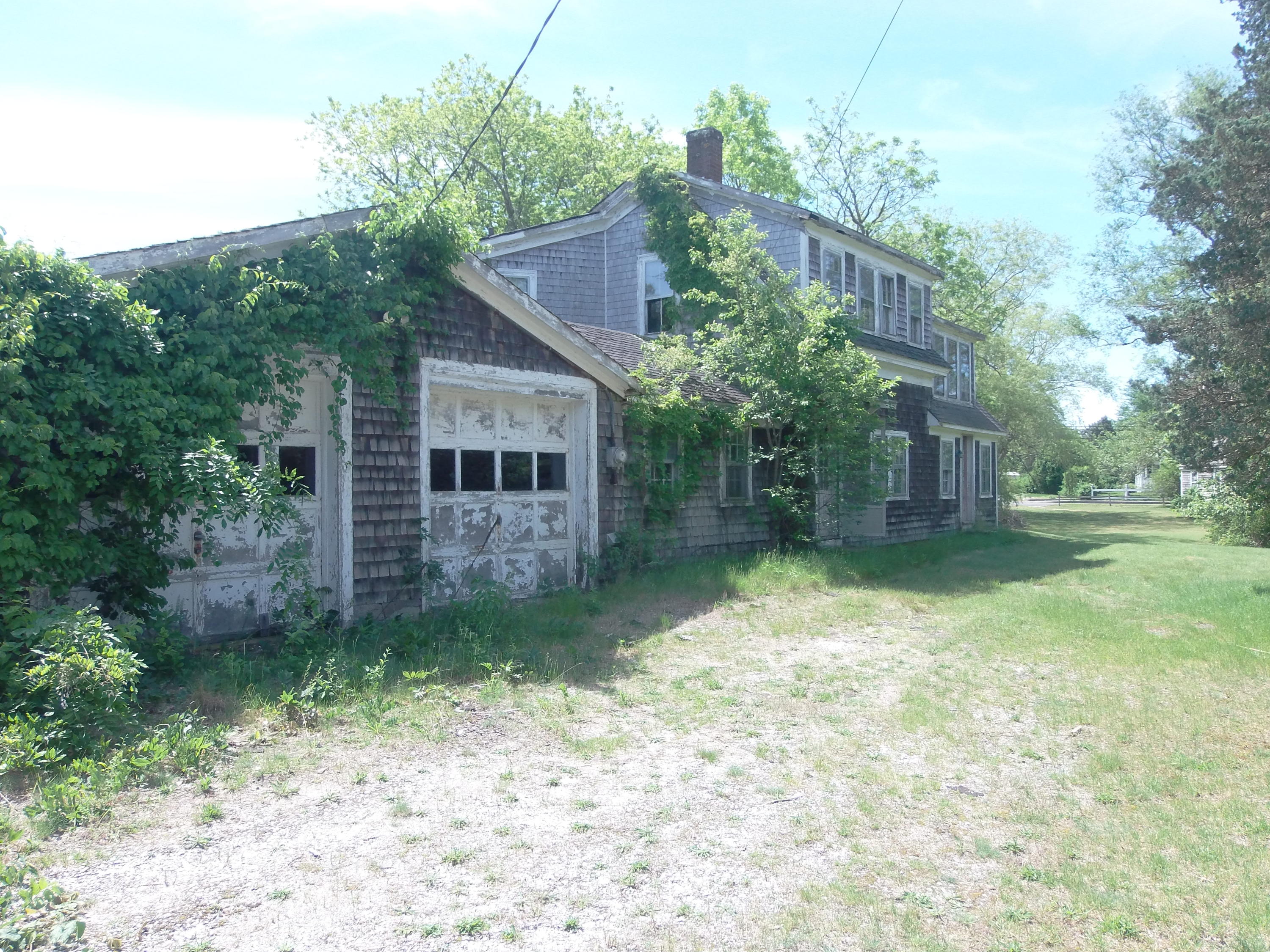 14 Pine Road West Dennis, MA 02670 - Photo 4 of 8 a house is sitting in middle of forest