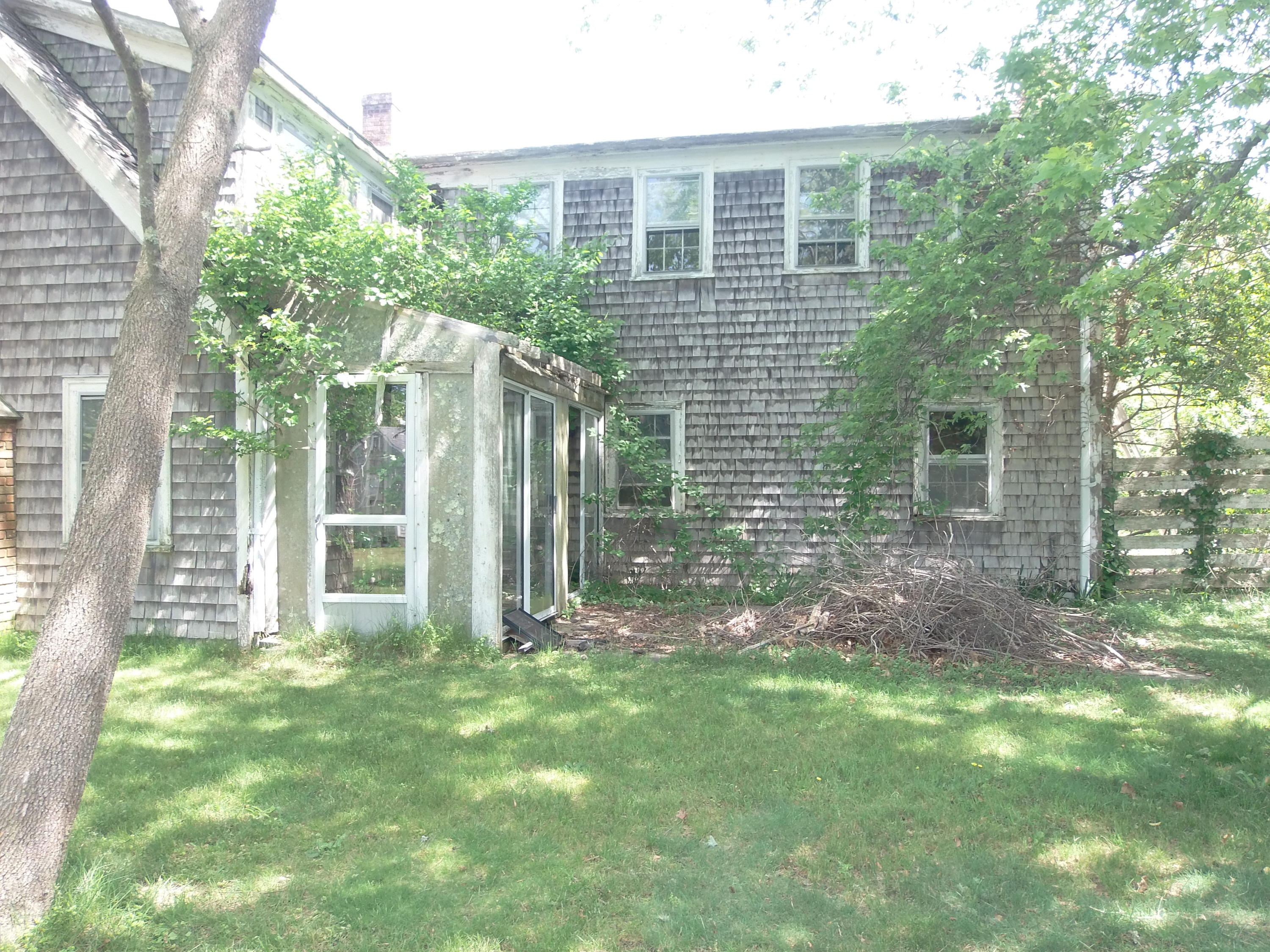 14 Pine Road West Dennis, MA 02670 - Photo 5 of 8 a view of a house with backyard