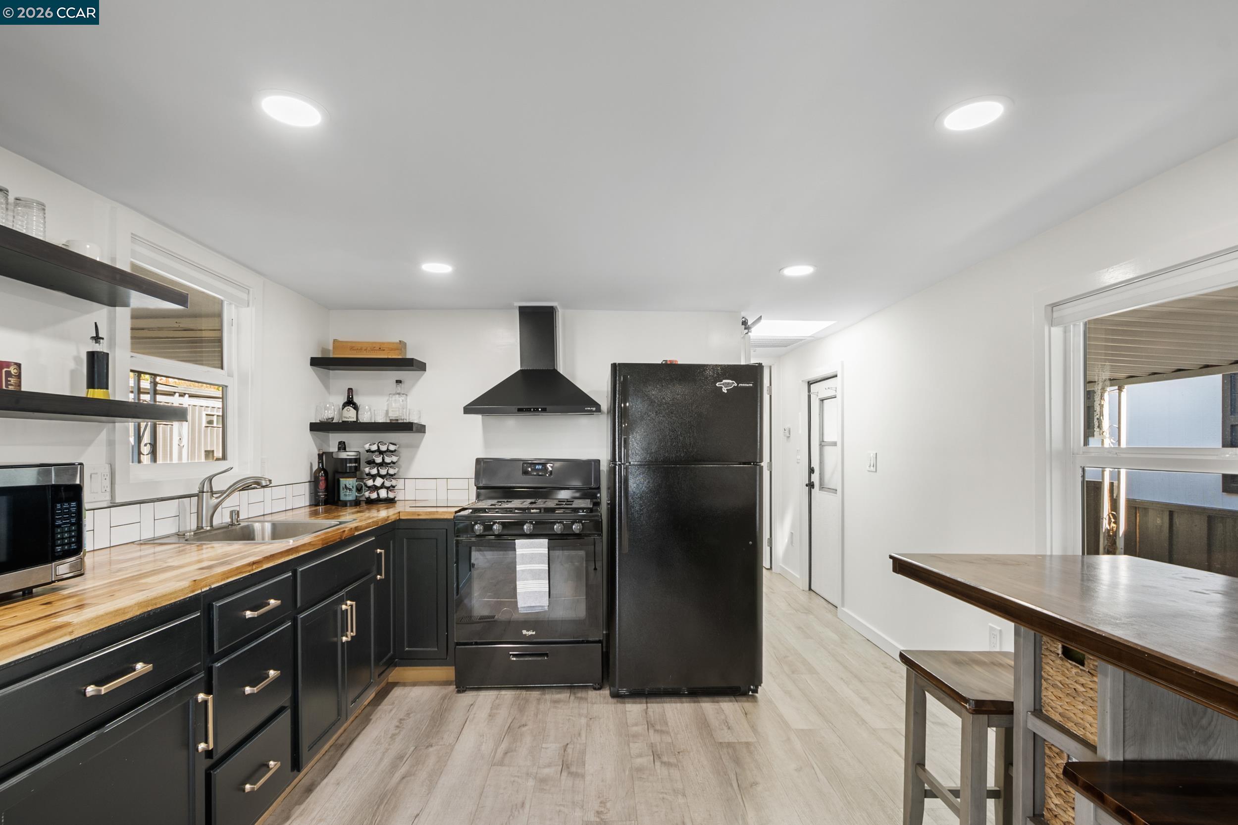 32 Galloway Drive Concord, CA 94518 - Photo 14 of 35 a kitchen with stainless steel appliances granite countertop a refrigerator and a stove top oven