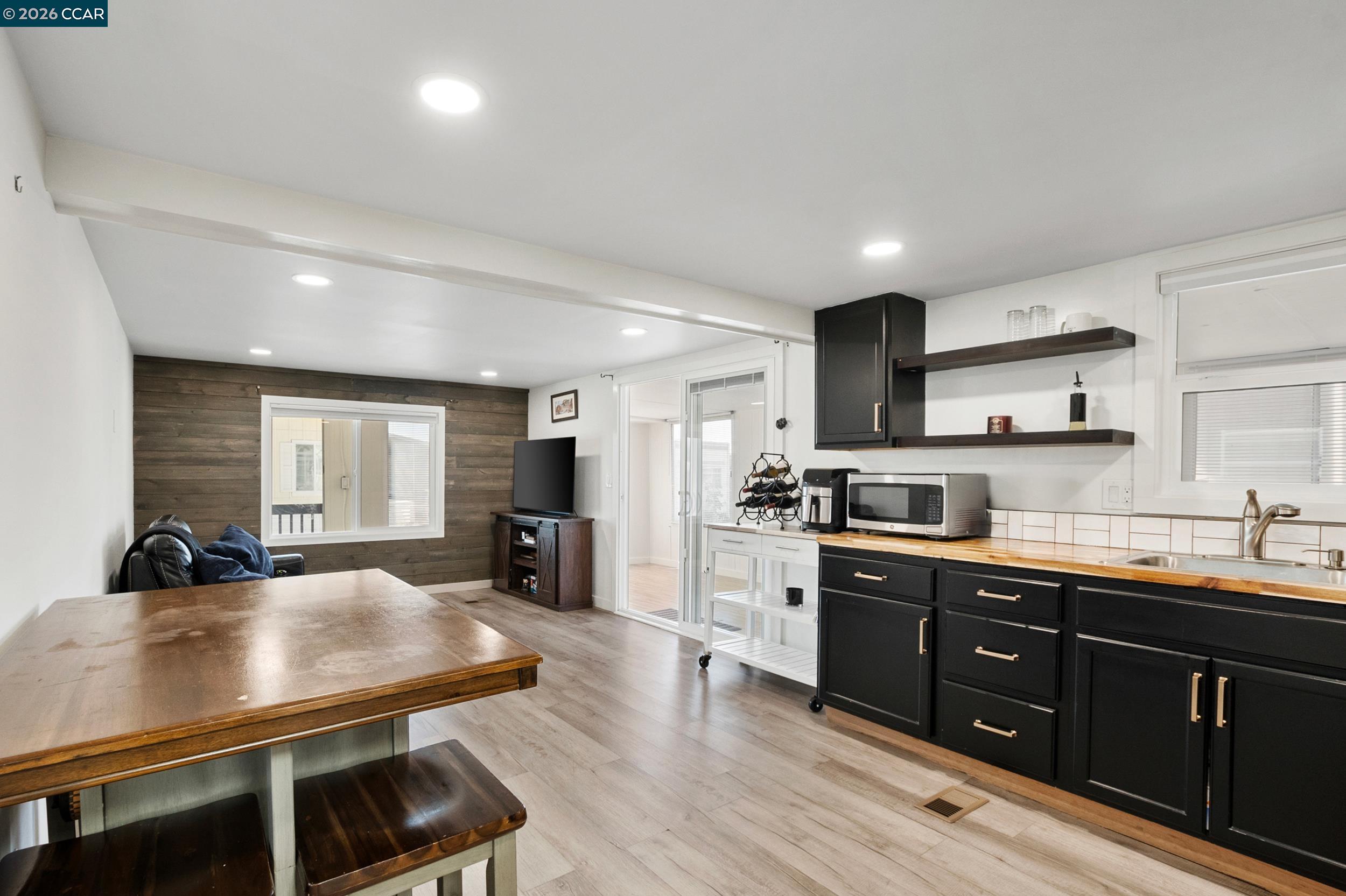 32 Galloway Drive Concord, CA 94518 - Photo 15 of 35 a kitchen with stainless steel appliances a sink a stove a refrigerator cabinets and living room view