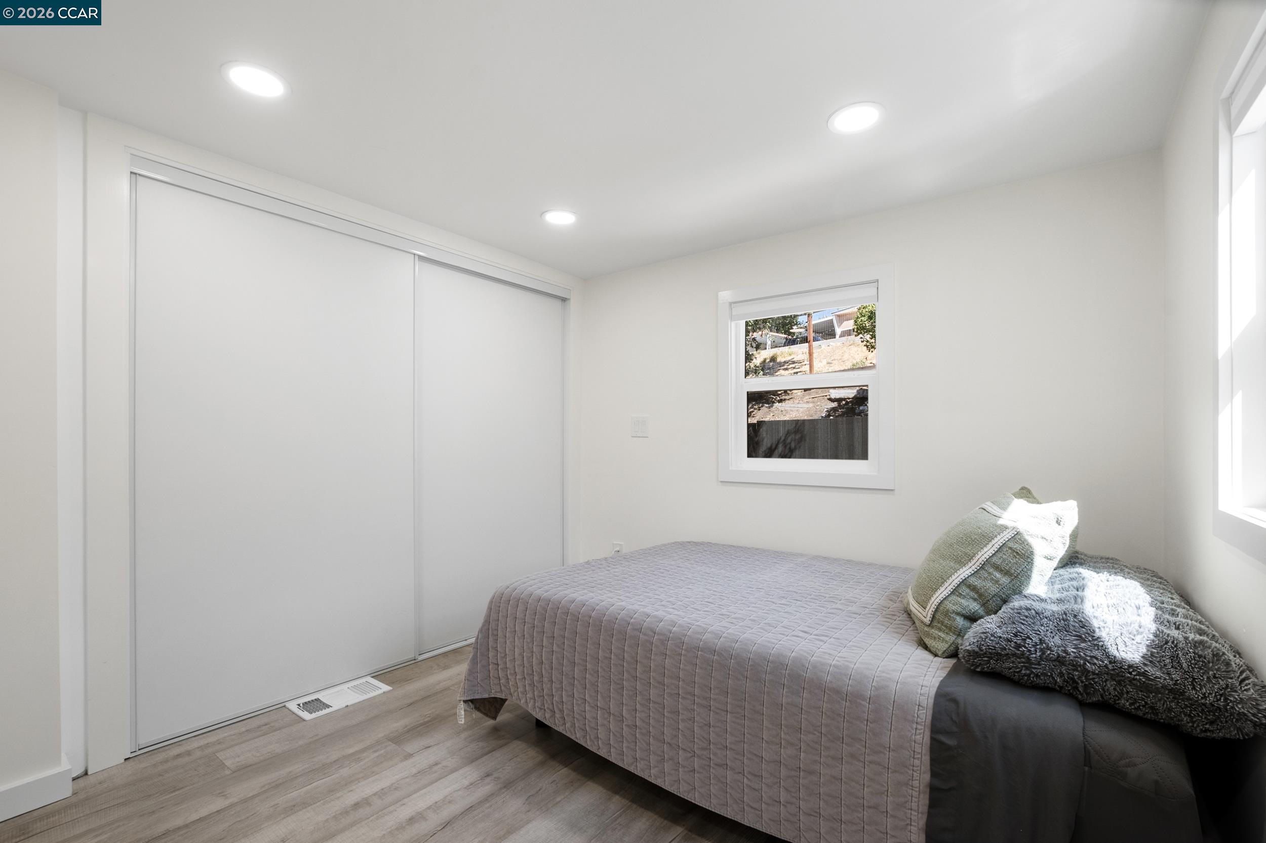 32 Galloway Drive Concord, CA 94518 - Photo 21 of 35 a bedroom with a bed and wooden floor