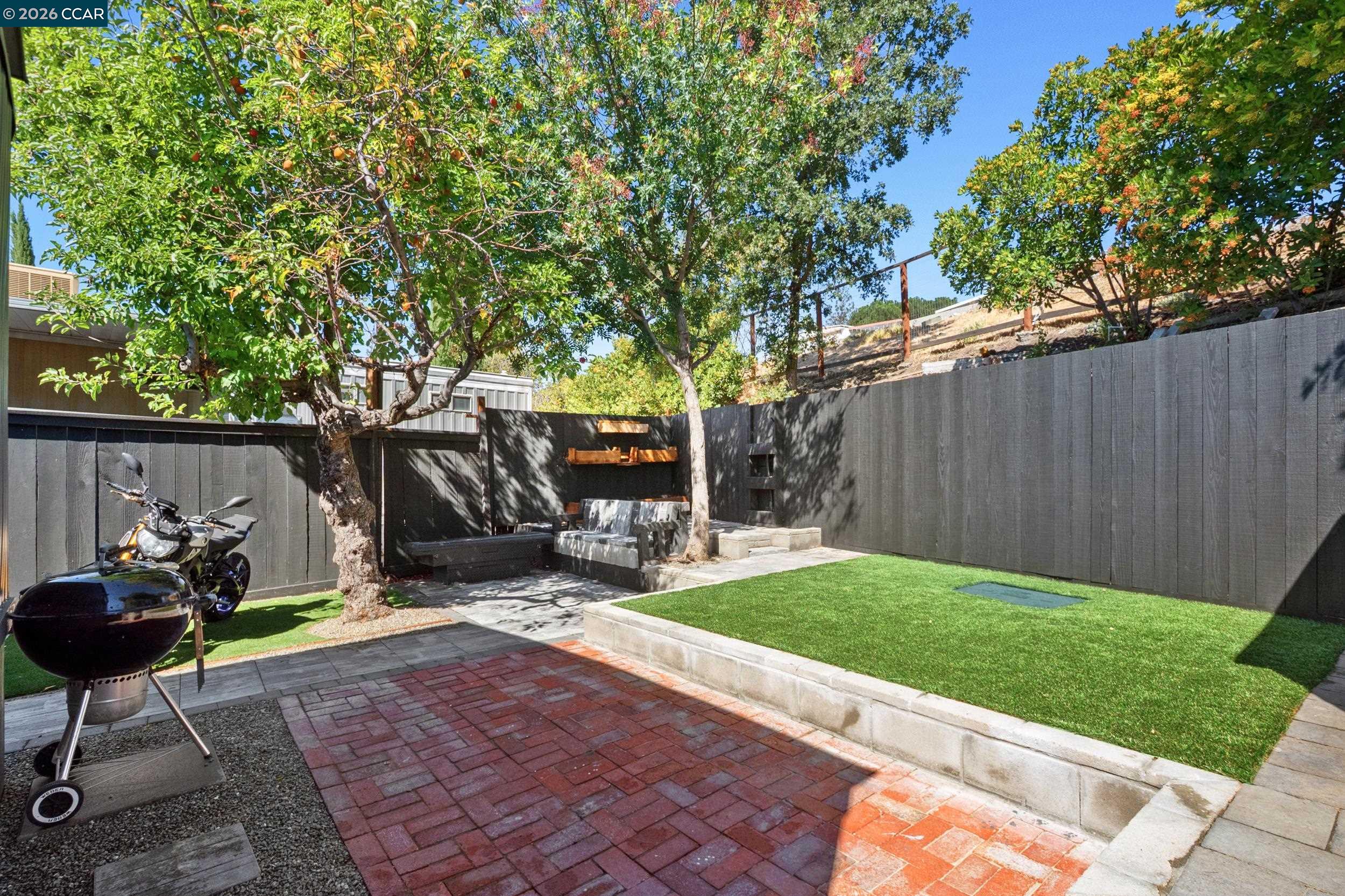 32 Galloway Drive Concord, CA 94518 - Photo 27 of 35 a view of a backyard with table and chairs potted plants and a slide