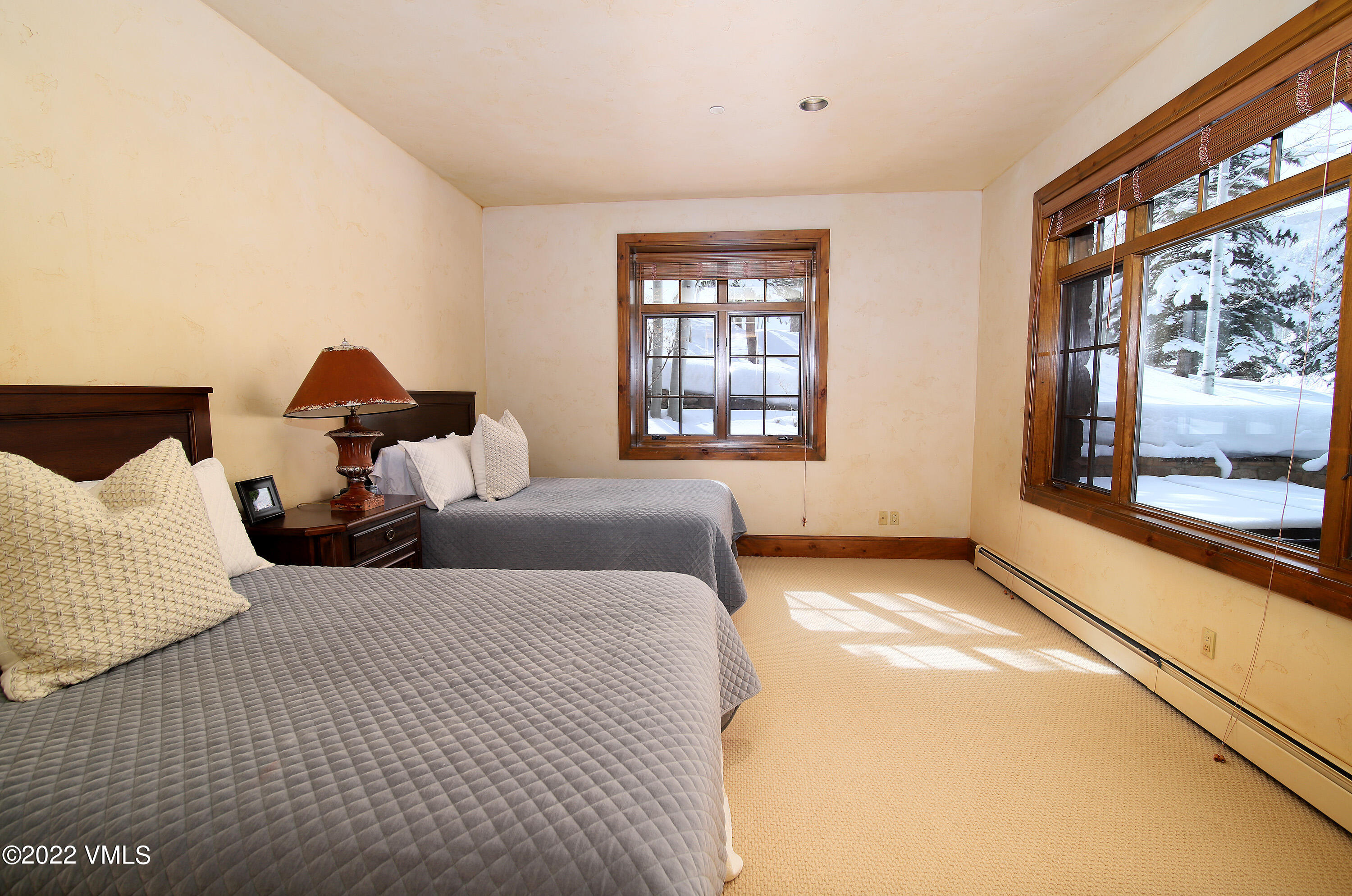 31 Trailside Lane Edwards, CO 81632 - Photo 17 of 30 a bedroom with two beds and a large window with outer view