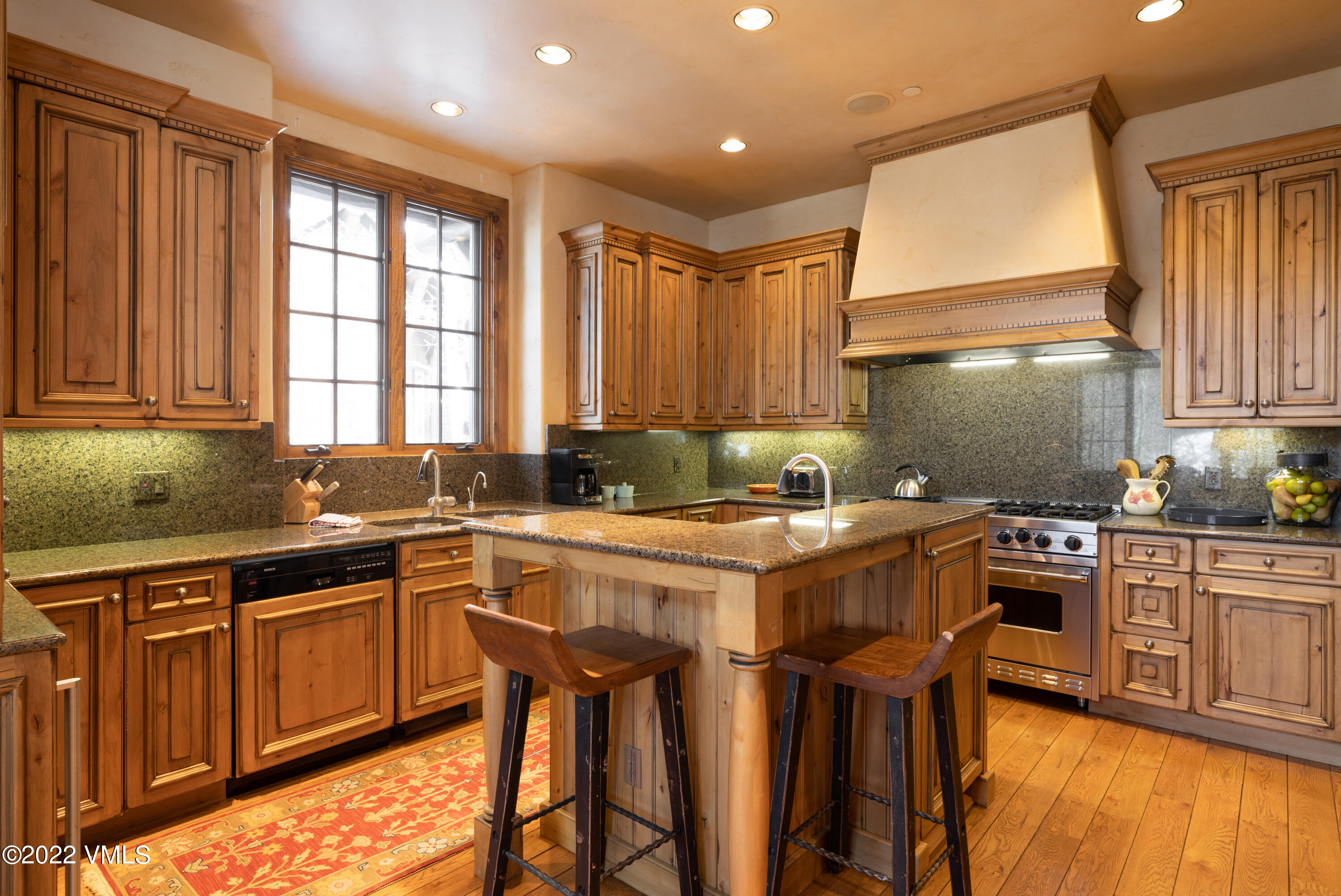 31 Trailside Lane Edwards, CO 81632 - Photo 6 of 30 a kitchen with stainless steel appliances granite countertop wooden cabinets a sink and a stove