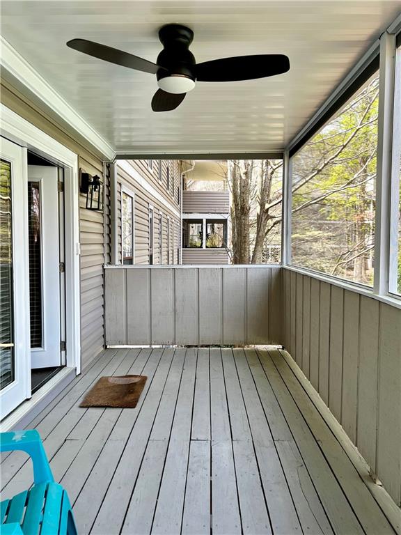 308 Wynnes Ridge Circle Southeast Marietta, GA 30067 - Photo 14 of 17 an empty room with wooden floor fan and windows