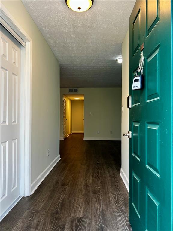 308 Wynnes Ridge Circle Southeast Marietta, GA 30067 - Photo 16 of 17 a view of empty room with wooden floor