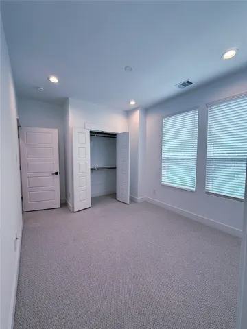 a bathroom with a sink a toilet a mirror a bathtub and shower