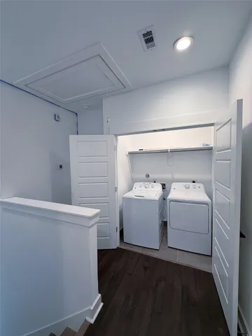 a view of hallway with wooden floor