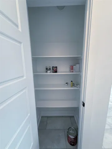 a view of an empty walk in closet