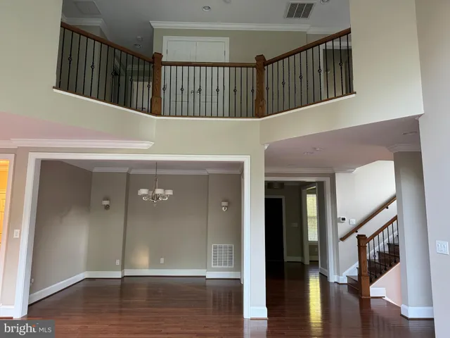 a kitchen with stainless steel appliances granite countertop a refrigerator a sink and a stove