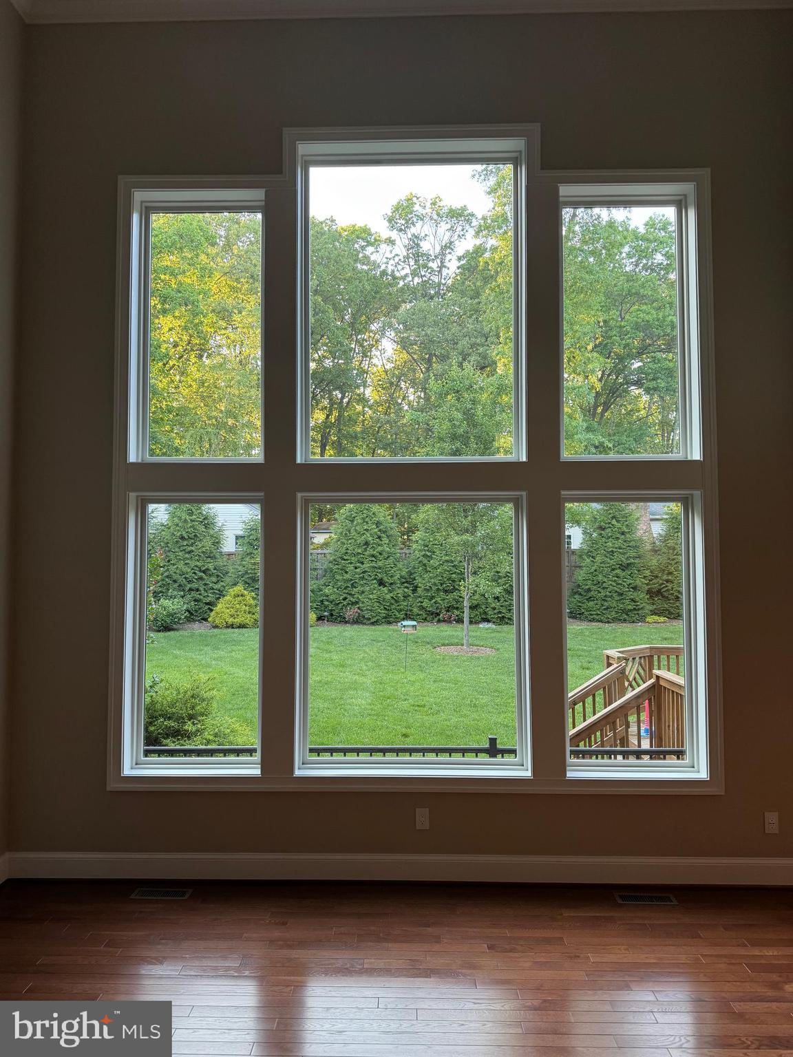 7702 Trammell Road Annandale, VA 22003 - Photo 20 of 68 a view of an empty room with wooden floor and a window