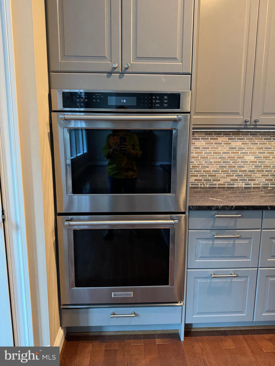 7702 Trammell Road Annandale, VA 22003 - Photo 23 of 68 a stove top oven sitting inside of a kitchen