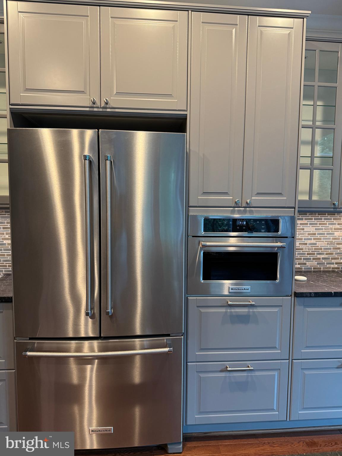 7702 Trammell Road Annandale, VA 22003 - Photo 25 of 68 a close view of a stove top oven and cabinets
