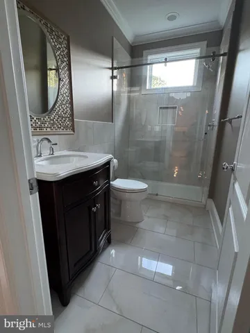 a view of room with hardwood floor and window