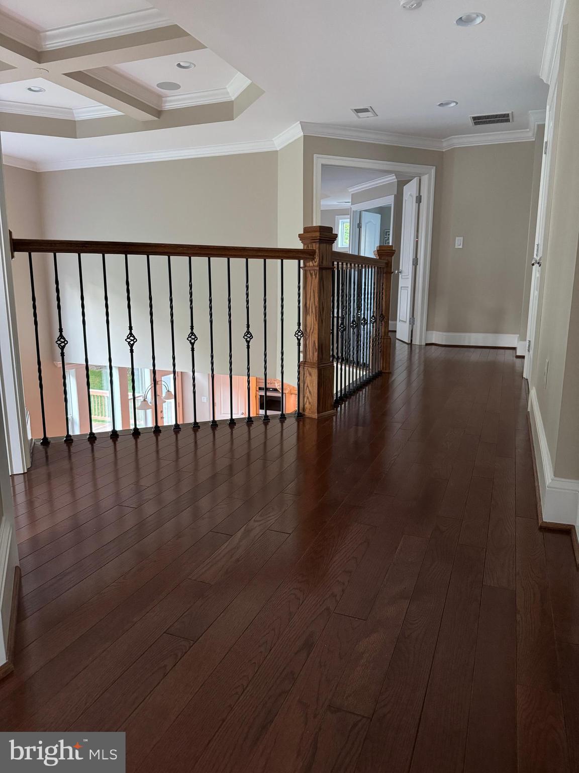 7702 Trammell Road Annandale, VA 22003 - Photo 37 of 68 a view of a hallway with wooden floor