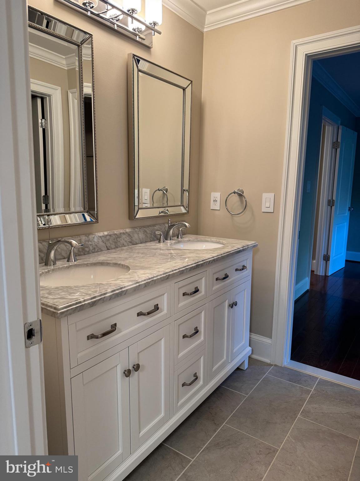 7702 Trammell Road Annandale, VA 22003 - Photo 40 of 68 a bathroom with a granite countertop sink and a mirror