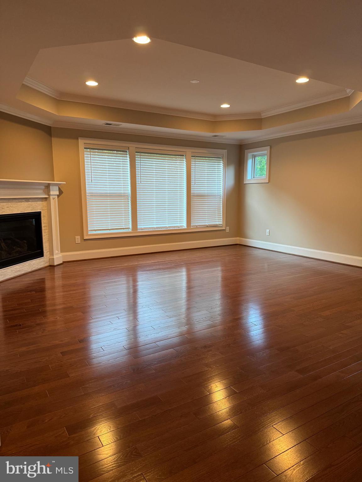 7702 Trammell Road Annandale, VA 22003 - Photo 48 of 68 a view of empty room with wooden floor and fan