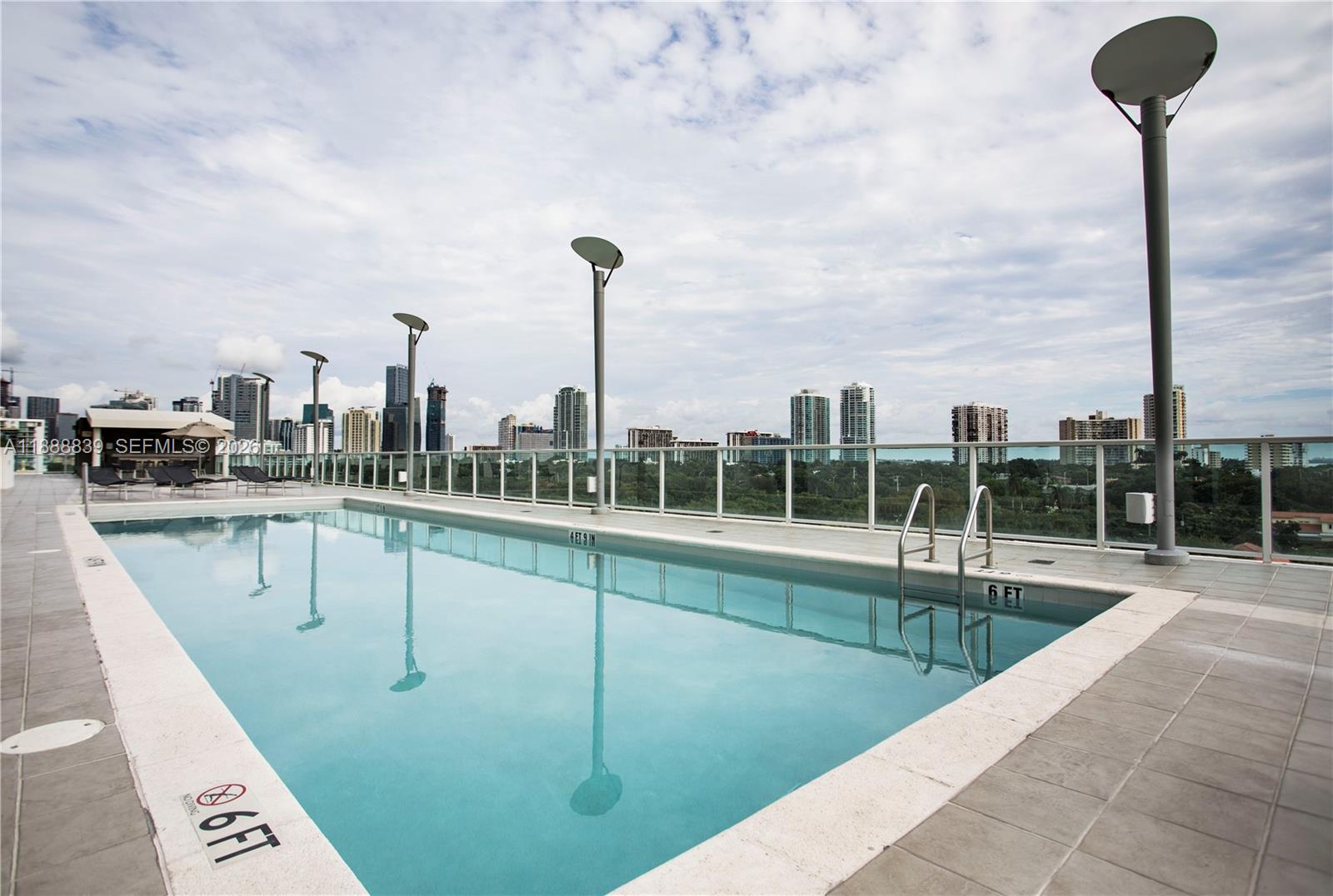 2525 Southwest 3rd Avenue, Unit 1106 Miami, FL 33129 - Photo 19 of 36 a view of a swimming pool with a lounge chair