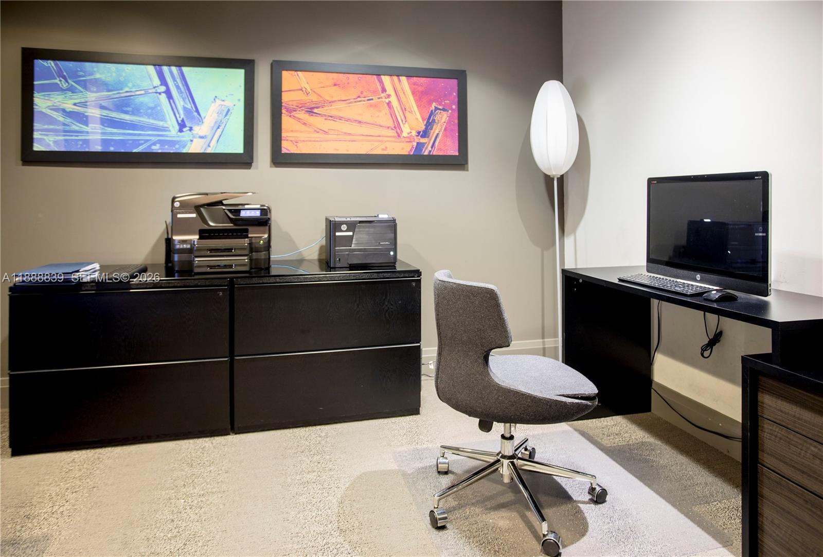 2525 Southwest 3rd Avenue, Unit 1106 Miami, FL 33129 - Photo 26 of 36 a room with a chair a mirror and a window