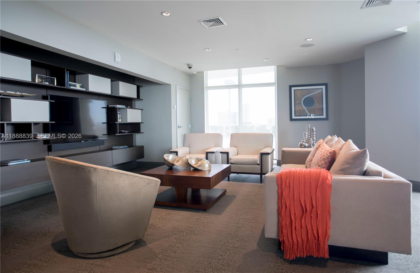 2525 Southwest 3rd Avenue, Unit 1106 Miami, FL 33129 - Photo 27 of 36 a living room with furniture and a window