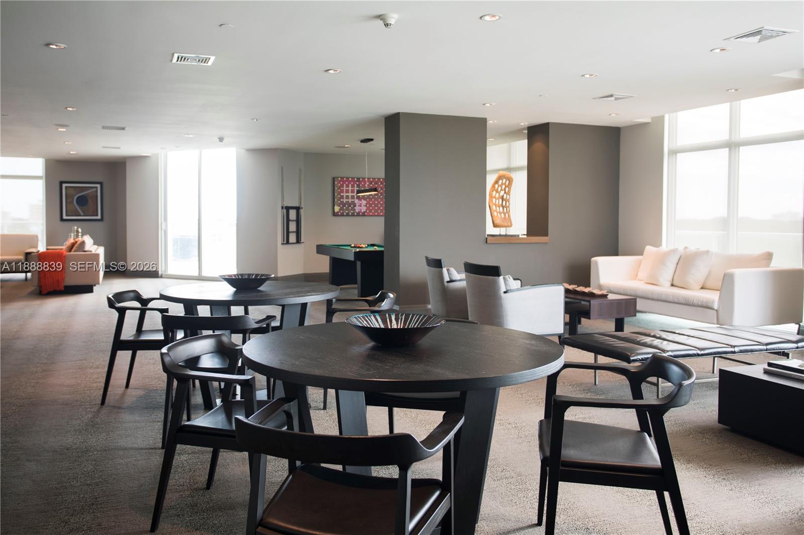 2525 Southwest 3rd Avenue, Unit 1106 Miami, FL 33129 - Photo 30 of 36 a view of a dining room with furniture and wooden floor